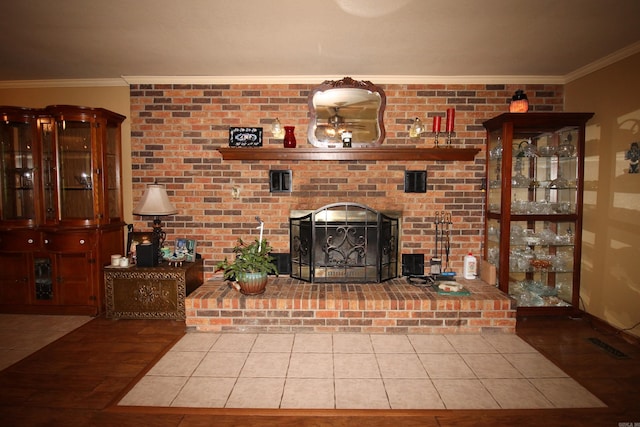 2102 N 22nd St, Paragould, AR 72450 - unfurnished living room featuring crown molding, tile patterned floors, and a brick fireplace