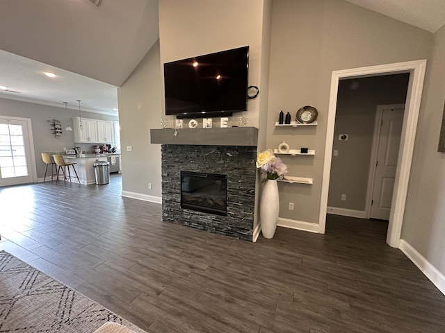 1008 Wildcat Ln, Jonesboro, AR 72405 - living room with dark wood-style floors, a fireplace, baseboards, and high vaulted ceiling