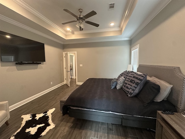 1008 Wildcat Ln, Jonesboro, AR 72405 - bedroom with a tray ceiling, wood finished floors, baseboards, crown molding, and ceiling fan