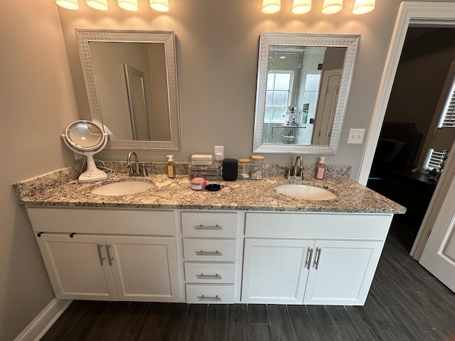 1008 Wildcat Ln, Jonesboro, AR 72405 - full bath featuring double vanity and wood finished floors