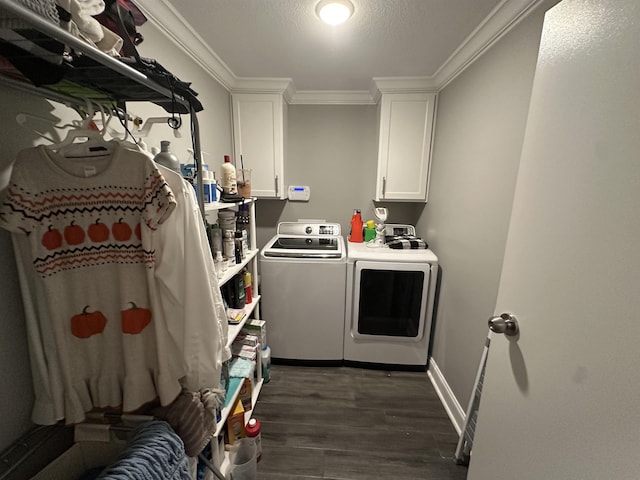 1008 Wildcat Ln, Jonesboro, AR 72405 - laundry area featuring washer and clothes dryer, cabinet space, dark wood finished floors, ornamental molding, and baseboards