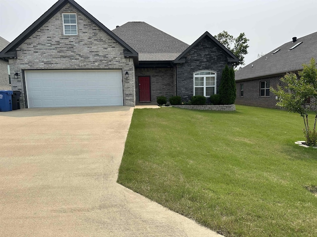 1008 Wildcat Ln, Jonesboro, AR 72405 - view of front facade featuring driveway, a front yard, and a shingled roof
