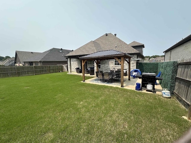1008 Wildcat Ln, Jonesboro, AR 72405 - rear view of house with roof with shingles, a gazebo, a patio, and stone siding