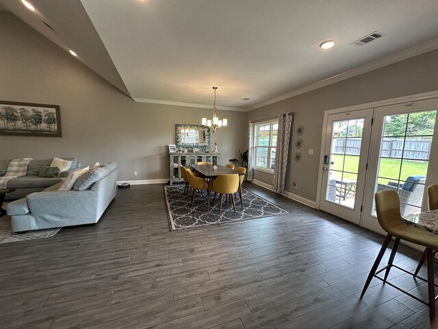 1008 Wildcat Ln, Jonesboro, AR 72405 - dining room with a chandelier, dark wood-type flooring, baseboards, crown molding, and lofted ceiling