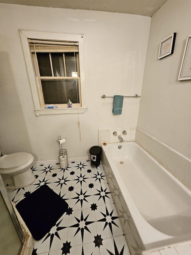 1421 W 25th St, North Little Rock, AR 72114 - full bathroom with a bath, toilet, and baseboards