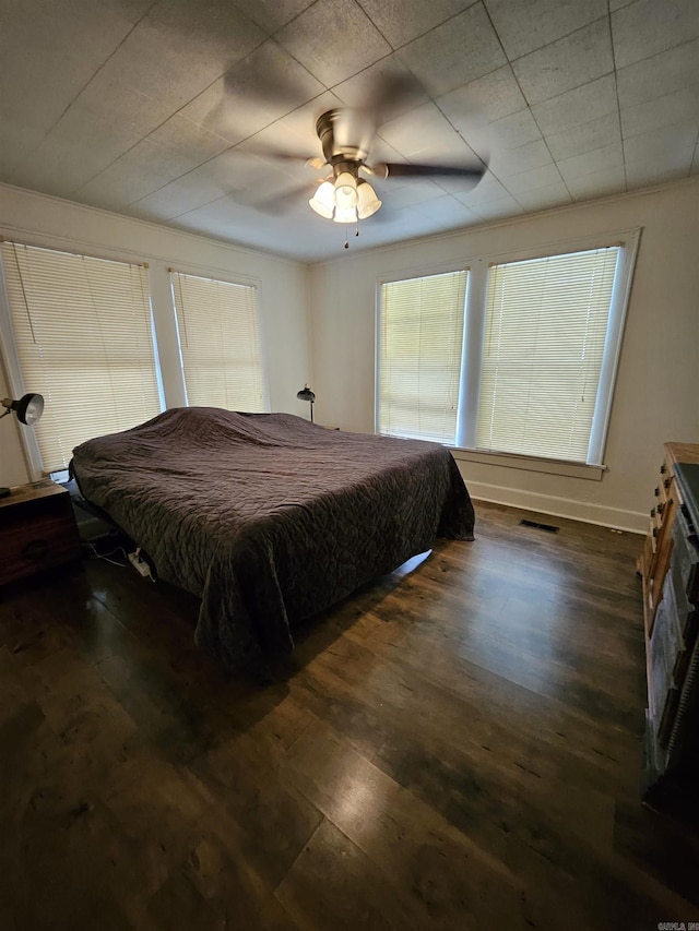 1421 W 25th St, North Little Rock, AR 72114 - bedroom with wood finished floors and ceiling fan