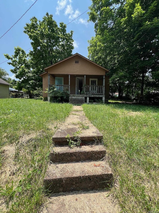 602 E Main, Flippin, AR 72634 - bungalow with a porch and stucco siding