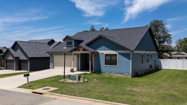 3069 Spring Mill Dr, Mountain Home, AR 72653 - view of front facade with driveway, an attached garage, board and batten siding, and a shingled roof
