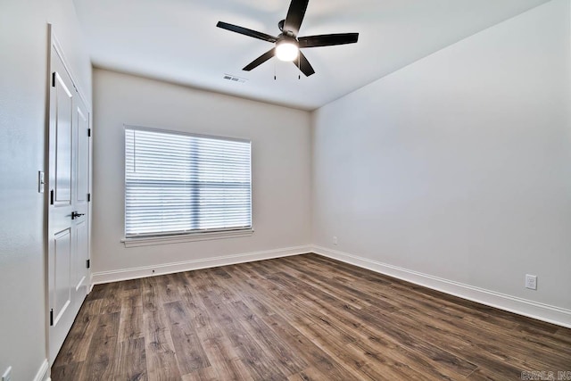 697 Western Hills Loop, Mountain Home, AR 72653 - spare room with dark wood-style floors, baseboards, and a ceiling fan