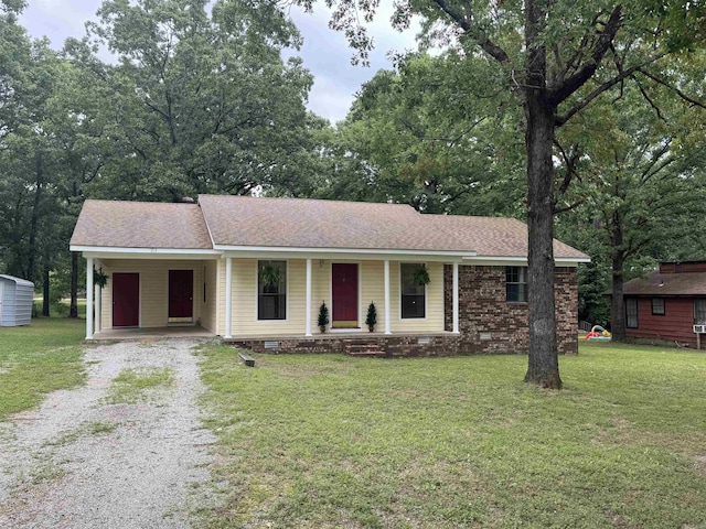 113 Boyd Rd, Southside, AR 72501 - ranch-style home with driveway, covered porch, an attached carport, and a front yard
