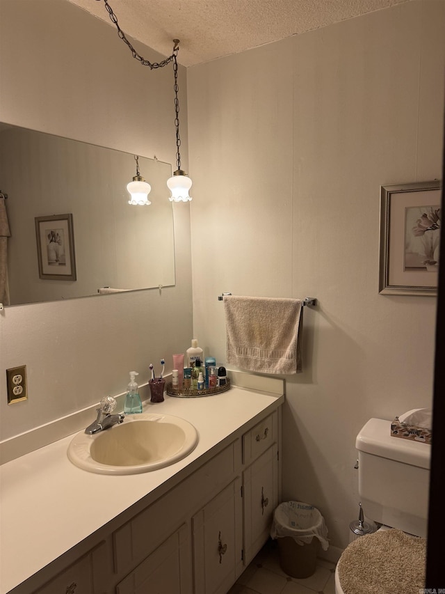 113 Boyd Rd, Southside, AR 72501 - half bath with a textured ceiling, vanity, tile patterned flooring, and toilet