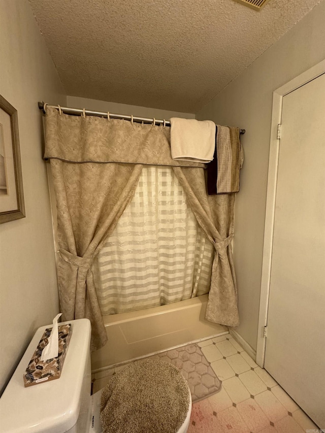 113 Boyd Rd, Southside, AR 72501 - full bathroom featuring a textured ceiling, shower / bath combination with curtain, tile patterned floors, and baseboards