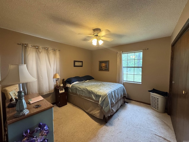 113 Boyd Rd, Southside, AR 72501 - bedroom featuring light carpet, a textured ceiling, a closet, and ceiling fan