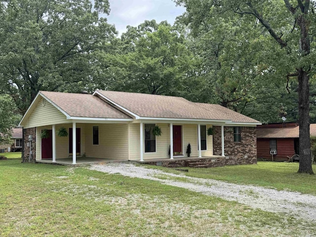 113 Boyd Rd, Southside, AR 72501 - ranch-style house with a carport, a porch, a front yard, roof with shingles, and driveway