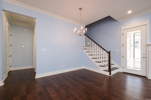 311 Parker St, North Little Rock, AR 72114 - foyer featuring crown molding, dark wood finished floors, stairway, a chandelier, and baseboards