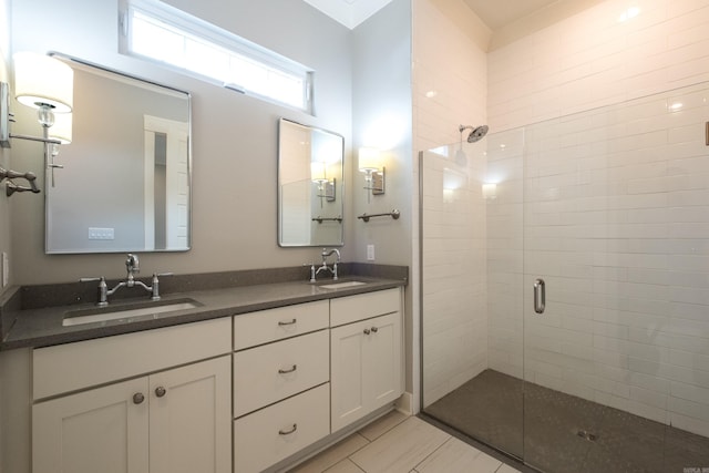 311 Parker St, North Little Rock, AR 72114 - bathroom featuring double vanity, a stall shower, and tile patterned flooring