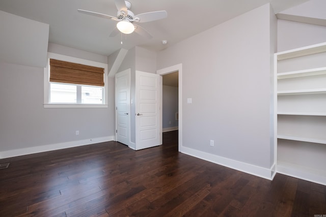 311 Parker St, North Little Rock, AR 72114 - unfurnished bedroom with dark wood finished floors, baseboards, and a ceiling fan