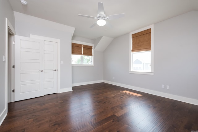 311 Parker St, North Little Rock, AR 72114 - additional living space featuring vaulted ceiling, baseboards, a ceiling fan, and dark wood-style floors