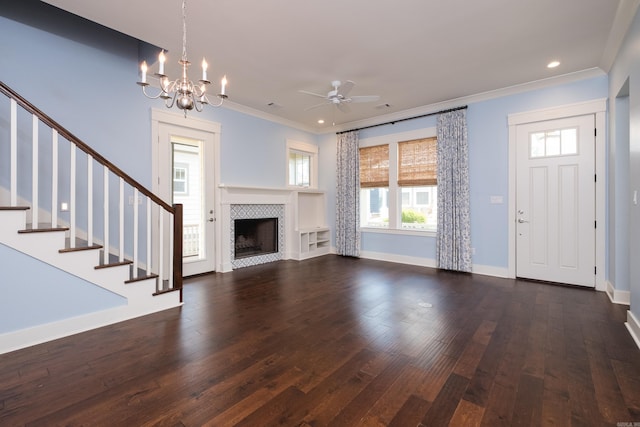 311 Parker St, North Little Rock, AR 72114 - unfurnished living room featuring ornamental molding, plenty of natural light, ceiling fan, dark wood-style floors, and a chandelier