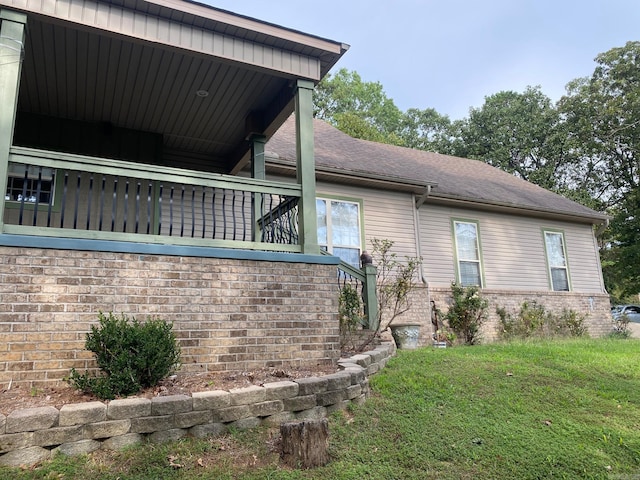 6 Maplewood W, Heber Springs, AR 72543 - view of side of property with brick siding and a lawn