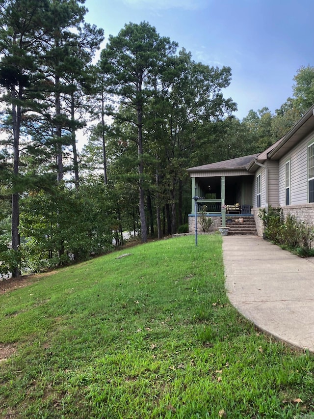 6 Maplewood W, Heber Springs, AR 72543 - view of grassy yard with a porch