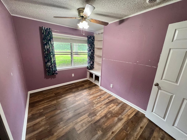 470 Lr 28, Foreman, AR 71836 - empty room featuring a textured ceiling, wood finished floors, a ceiling fan, crown molding, and baseboards
