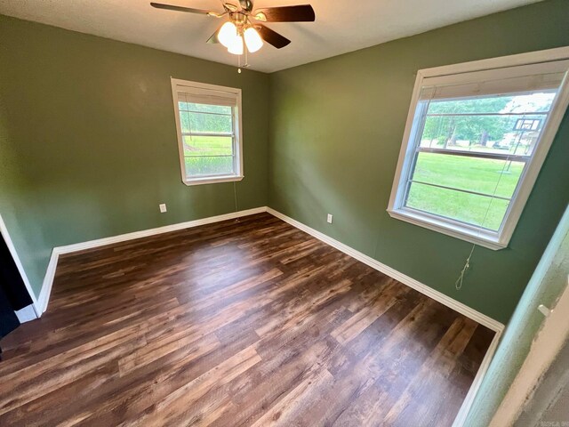 470 Lr 28, Foreman, AR 71836 - unfurnished room featuring baseboards, dark wood finished floors, and a ceiling fan
