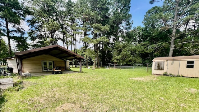 470 Lr 28, Foreman, AR 71836 - view of yard with french doors, a patio area, and an outbuilding