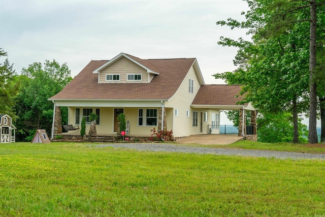 125 Gassaway, Searcy, AR 72143 - view of front of house featuring a porch, a front yard, gravel driveway, and roof with shingles