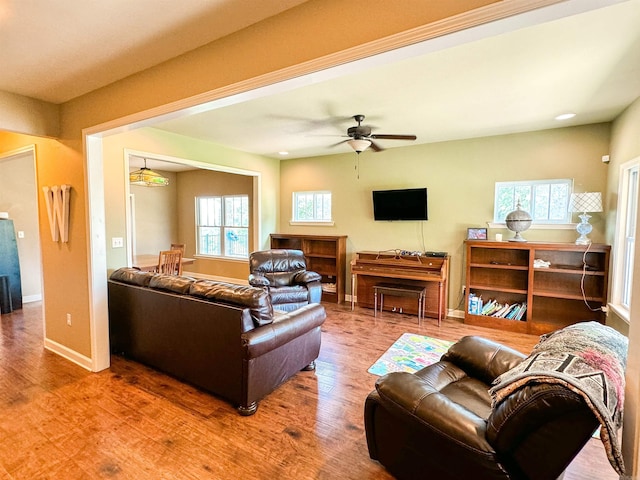 125 Gassaway, Searcy, AR 72143 - living room with wood finished floors, a ceiling fan, and baseboards
