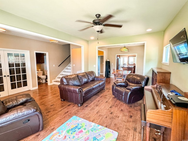 125 Gassaway, Searcy, AR 72143 - living room featuring french doors, wood finished floors, ceiling fan, stairway, and recessed lighting