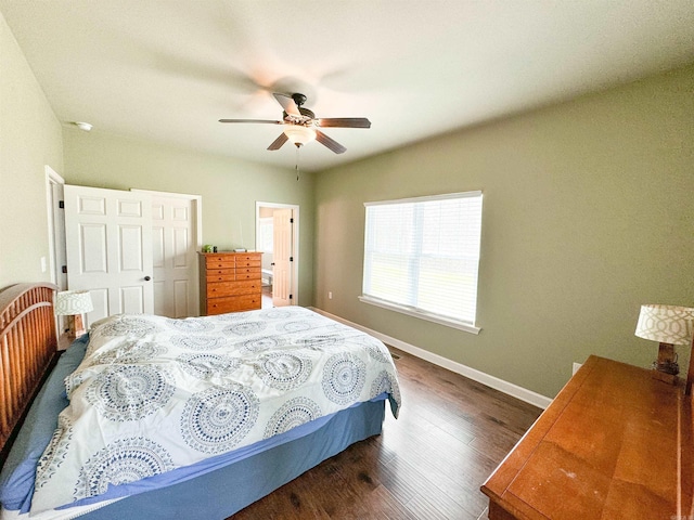 125 Gassaway, Searcy, AR 72143 - bedroom with dark wood-style flooring, baseboards, and a ceiling fan