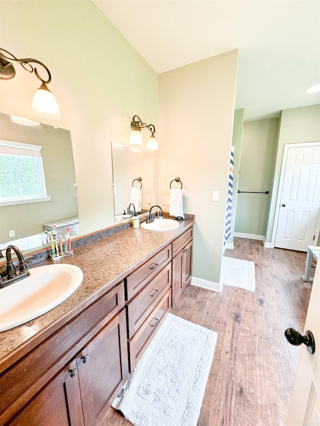 125 Gassaway, Searcy, AR 72143 - full bath featuring double vanity, wood finished floors, and baseboards