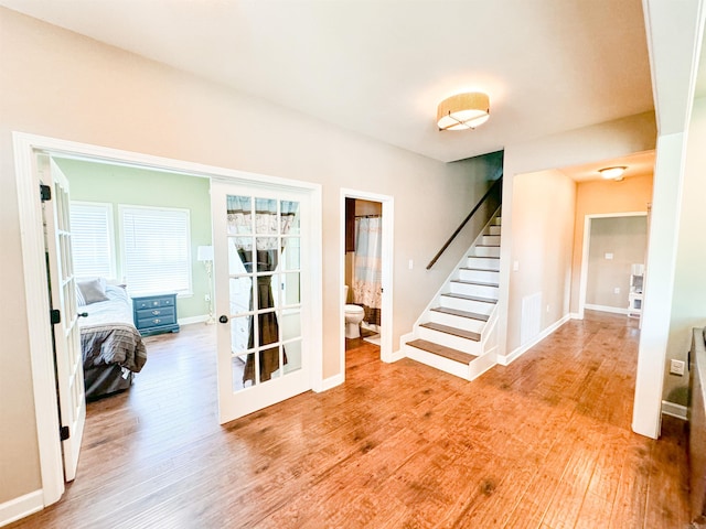 125 Gassaway, Searcy, AR 72143 - stairs featuring wood finished floors and baseboards
