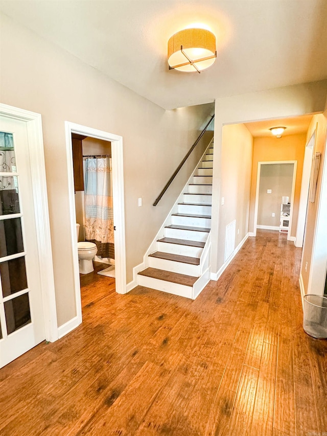 125 Gassaway, Searcy, AR 72143 - staircase featuring wood finished floors and baseboards