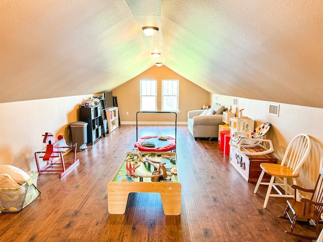 125 Gassaway, Searcy, AR 72143 - recreation room with a textured ceiling, wood finished floors, and vaulted ceiling
