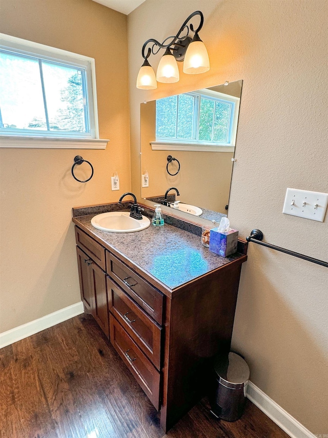 125 Gassaway, Searcy, AR 72143 - bathroom featuring vanity, wood finished floors, and baseboards