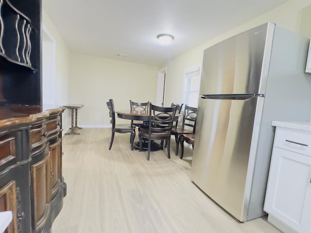 9689 W Ar 56th Hwy, Wideman, AR 72585 - dining room with light wood finished floors and baseboards