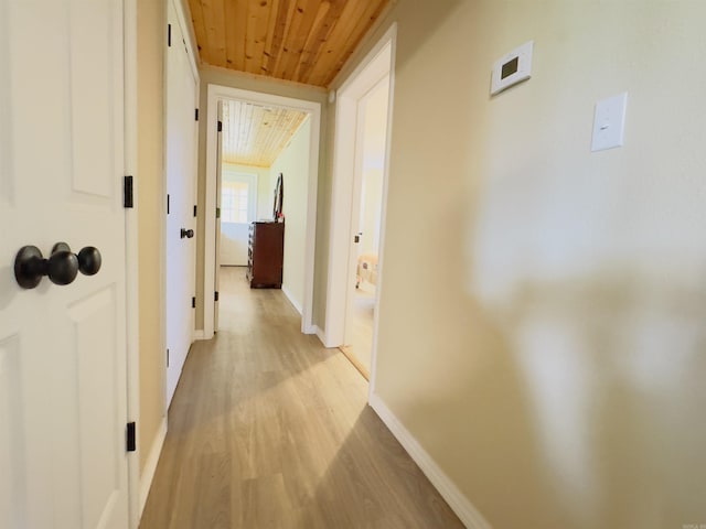 9689 W Ar 56th Hwy, Wideman, AR 72585 - hallway featuring wood ceiling, light wood-style flooring, and baseboards