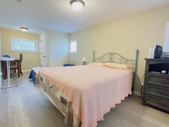 9689 W Ar 56th Hwy, Wideman, AR 72585 - bedroom featuring wood finished floors and baseboards