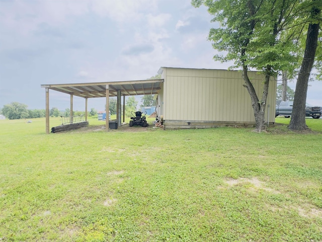 9689 W Ar 56th Hwy, Wideman, AR 72585 - view of grassy yard featuring an outbuilding, an attached carport, and an outdoor structure