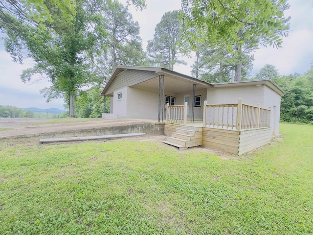 9689 W Ar 56th Hwy, Wideman, AR 72585 - rear view of house with a yard and a wooden deck