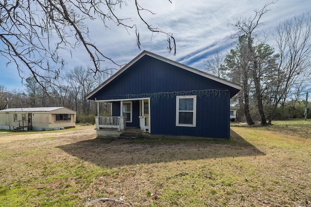 313 W Miller St, Gurdon, AR 71743 - view of front of home featuring covered porch and a front lawn