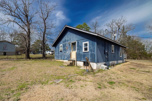 313 W Miller St, Gurdon, AR 71743 - view of side of home with entry steps and a lawn