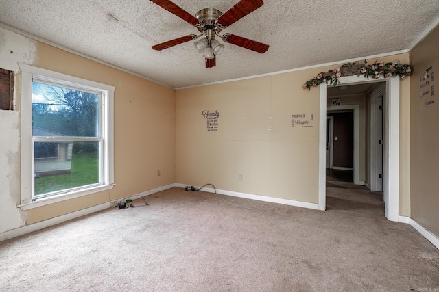 313 W Miller St, Gurdon, AR 71743 - empty room with light carpet, a textured ceiling, ceiling fan, ornamental molding, and baseboards