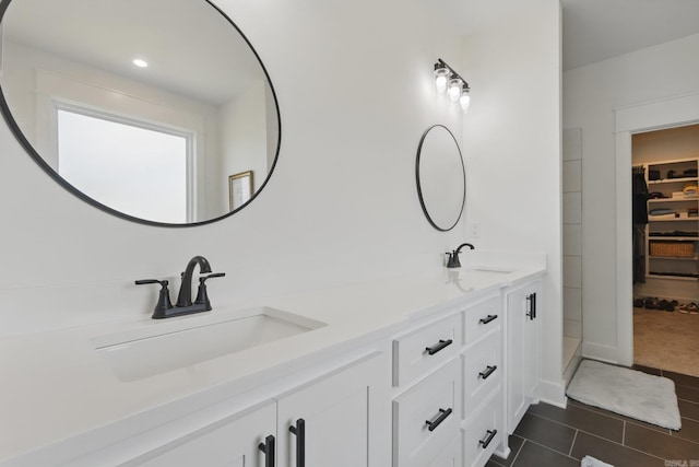 10584 Gunter Loop, Benton, AR 72019 - full bathroom with double vanity, tile patterned flooring, a spacious closet, and recessed lighting