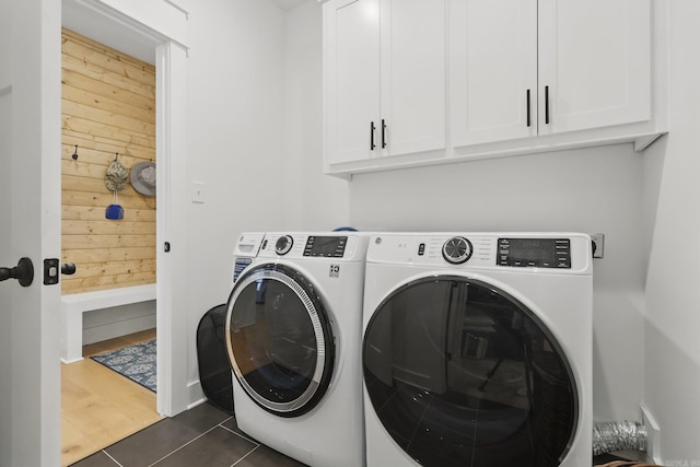 10584 Gunter Loop, Benton, AR 72019 - washroom featuring cabinet space, washer and dryer, and dark tile patterned floors