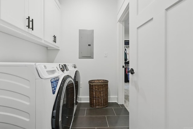 10584 Gunter Loop, Benton, AR 72019 - washroom featuring electric panel, cabinet space, washing machine and dryer, dark tile patterned floors, and baseboards