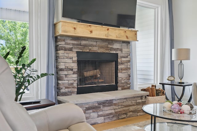 10584 Gunter Loop, Benton, AR 72019 - living area featuring wood finished floors and a stone fireplace