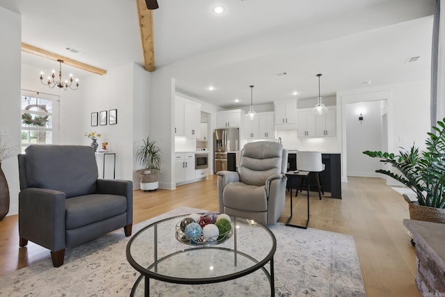 10584 Gunter Loop, Benton, AR 72019 - living area featuring light wood-style floors, recessed lighting, a chandelier, beamed ceiling, and baseboards